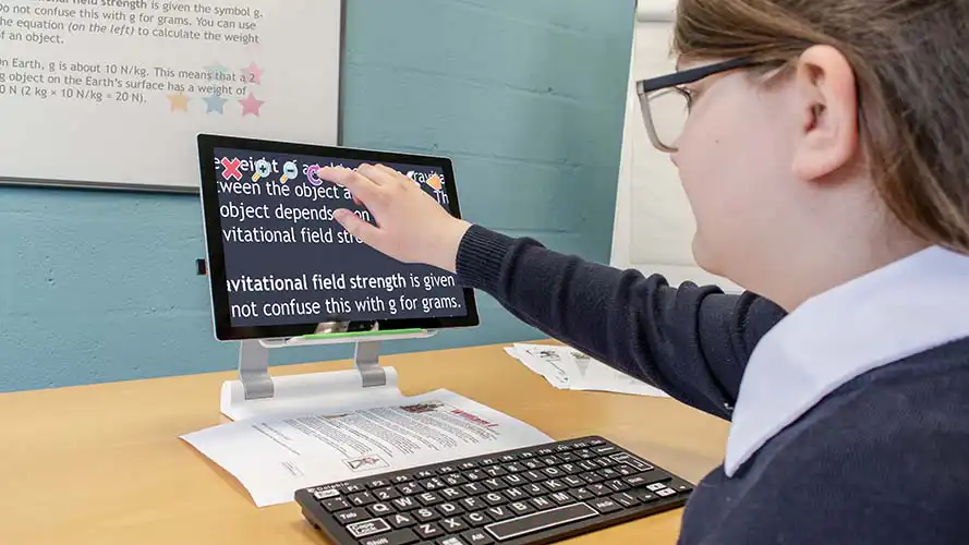 Student using Connect & Learn on a tablet to view the classroom whiteboard.